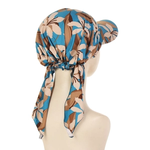 Detail view of floral headscarf hat with sun visor and long brown leaf pattern ties