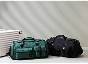 Detail view of large-capacity gym bags in black and green with multiple storage sections