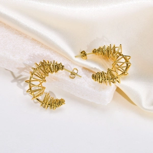 Elegant gold twisted wire C-ring earrings for women with a unique geometric bird nest design