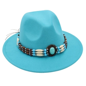 Detailed view of the turquoise felt fedora featuring ethnic beaded band and gemstone