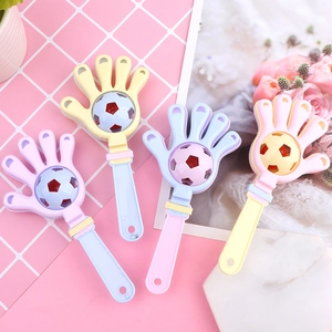 Set of four pastel macaron colored baby hand clappers with integrated football rattle design