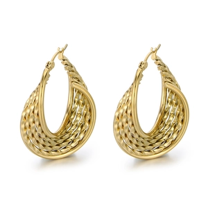 Elegant gold-tone U-shaped earrings featuring a vintage woven texture and polished finish