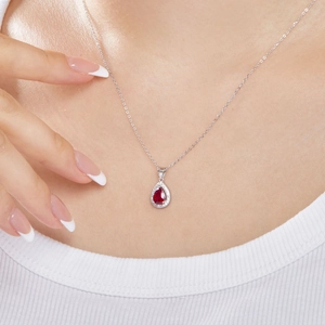 Elegant S925 sterling silver necklace with pear-cut red gemstone and diamond halo pendant