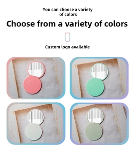 Four colors of portable round folding mirrors with plastic cases in a flat layout