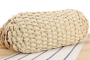 Close-up of bohemian woven bag showing detailed straw texture and craftsmanship