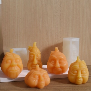 Halloween pumpkin face silicone molds with orange soy wax candles for DIY decorations