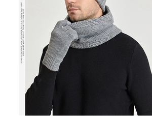 Detail of grey chunky knit winter scarf and gloves set with warm fleece lining