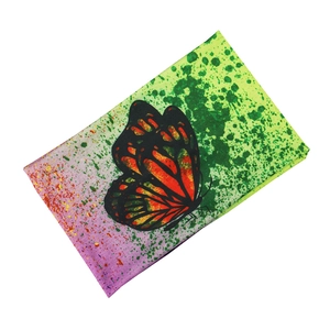 Elastic yoga headband featuring a vibrant butterfly print with pink to green gradient