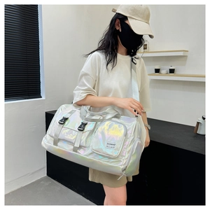 Detail of holographic silver waterproof travel bag with adjustable strap and buckle pocket