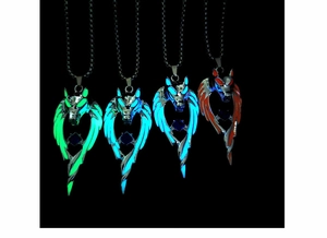 Luminous wolf head pendants glowing in green, blue, and orange colors with blue gems
