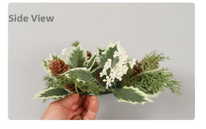 Macro view of Christmas candle ring with pine cones, white berries, and frosted leaves