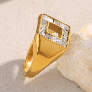 Detail of 18K gold-plated geometric ring with square cutout and inlaid baguette zircons