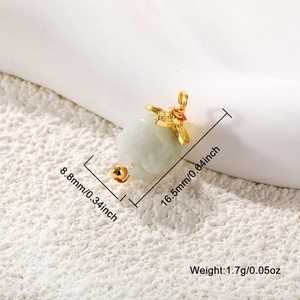 Detail shot of a gold-plated stone pendant showing dimensions 16.5mm by 8.8mm