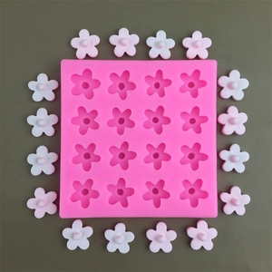 Top view of pink 16-cavity square silicone mold for making small resin flowers