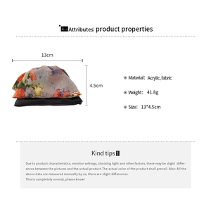 Detail view of floral fabric scrunchie hair clip with 13cm x 4.5cm dimensions