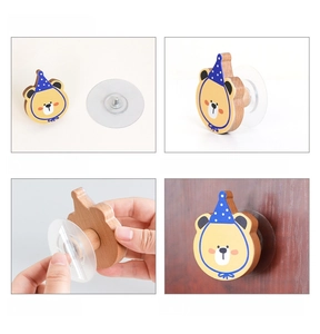 Detail of cute bear wooden wall hook installation process with strong adhesive sticker
