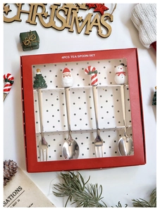 Détail du service de 4 cuillères et fourchettes de Noël en acier inox en coffret