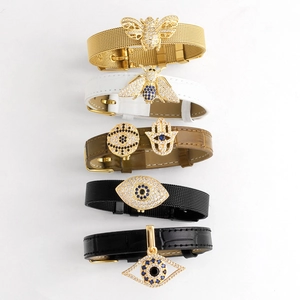 Evil eye and Hamsa hand charms on leather and mesh steel watchband bracelets