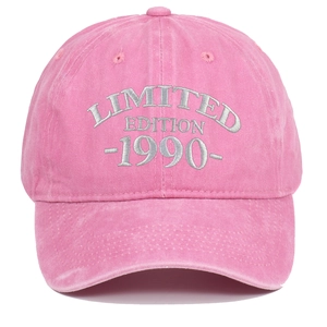Close-up of pink washed cotton baseball cap with silver 1990 Limited Edition embroidery