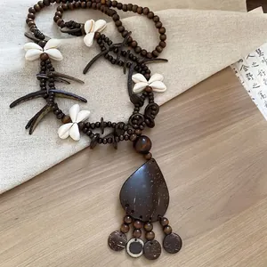 Bohemian handmade beaded necklace with brown wood beads and butterfly shell pendant