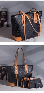 Three-piece black textured leather tote bag set with brown trim and gold chain detail