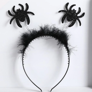 Halloween headband with double black spiders, spring coils, and festive feather trim