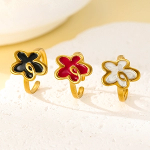 Three 18k gold plated stainless steel floral open rings with enamel in black red and white