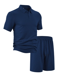 Detail of navy blue men polo set showing 3D herringbone texture and drawstring shorts