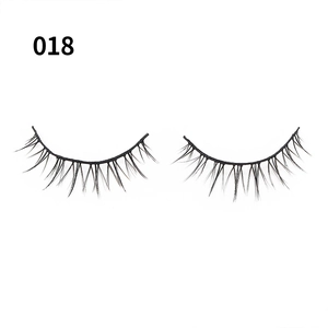 Close-up of style 018 natural thick spiky false eyelashes on white background