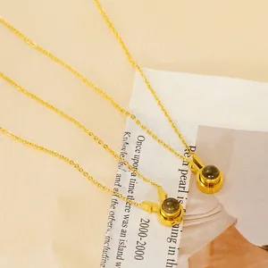Golden titanium steel zodiac rabbit pendant necklace with 100 languages projection stone