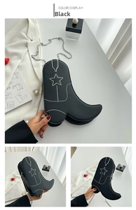 Detail of creative black boot-shaped shoulder bag with white star embroidery and silver chain