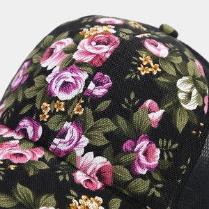 Detailed macro view of vintage rose floral patterns on high-quality black canvas fabric