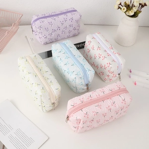 Floral quilted fabric pencil cases in five colors with zipper closures and large capacity