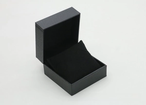Detail view of the open black lychee pattern watch box with a soft display pillow