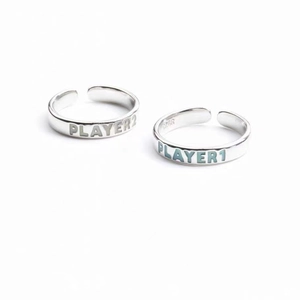 Detailed close-up of S925 sterling silver adjustable rings with Player 1 and Player 2 engraving