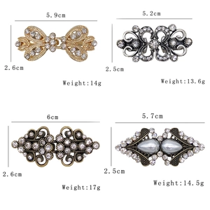 Detail view of retro alloy sweater clips with rhinestones and pearls in 2x2 grid