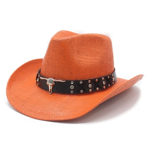 Detail of orange woven straw cowboy hat with black leather band and silver bull head ornament