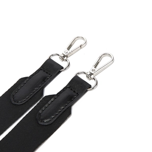 Detail of durable black nylon strap with silver metal swivel hooks and leather reinforcement