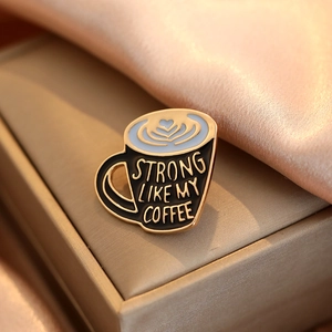 Black coffee cup enamel pin with heart latte art and Strong Like My Coffee slogan