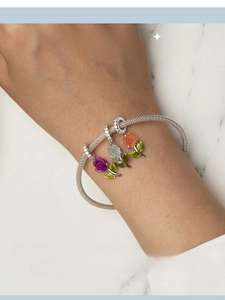 Detailed view of an S925 silver bracelet featuring vibrant enamel rose flower charms