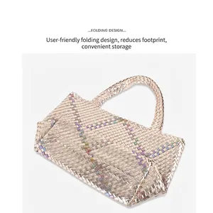 Handwoven champagne gold tote bag with iridescent stripes and foldable design