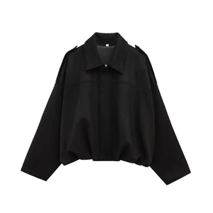 Detail showing the shoulder epaulettes and collar of the black cropped bomber jacket