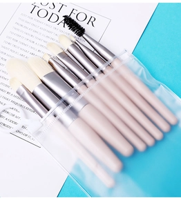 Close-up of 8-piece makeup brush set with beige wooden handles in an EVA zipper bag