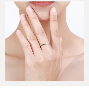 Close-up of a minimalist S925 sterling silver square ring worn on a finger