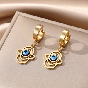 Gold stainless steel Hamsa Hand earrings with Evil Eye charms on elegant satin fabric