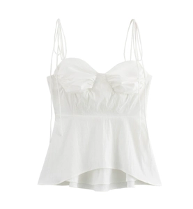 Detail of white camisole top featuring spaghetti straps and gathered pleated chest design