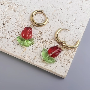 Detail view of 18K gold-plated stainless steel tulip earrings with red flower petals