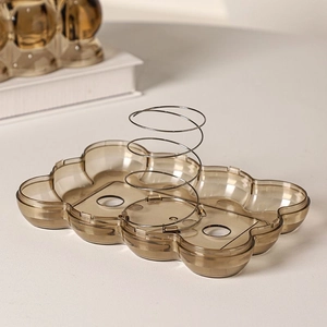 Detail of amber luxury tissue box with multi-compartment storage tray and metal spring