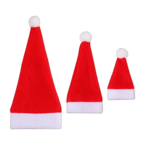 Three red brushed fabric Christmas hats in small medium and large sizes for table decor