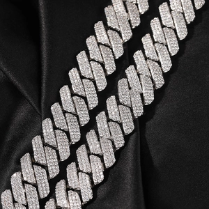Detailed close-up of 20mm silver Cuban link necklace with shimmering zircon stones